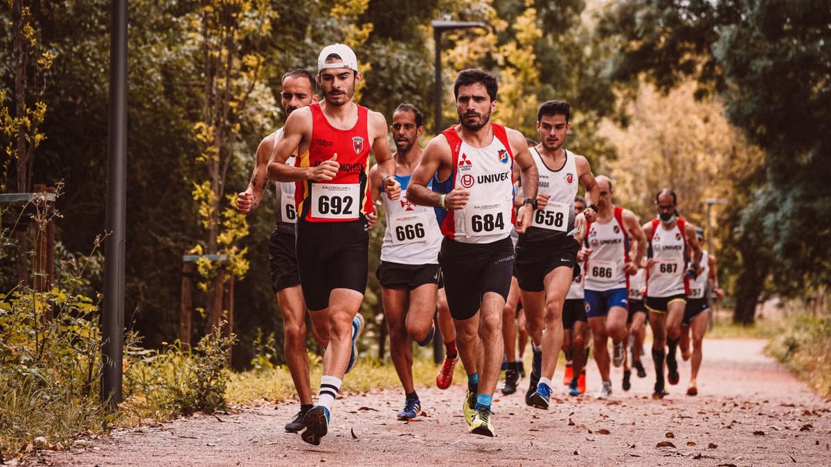 A dynamic scene of male athletes participating in an outdoor marathon race.